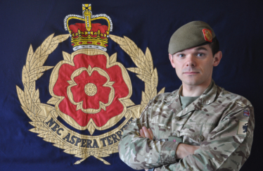 Paul Athans with Regimental Flag